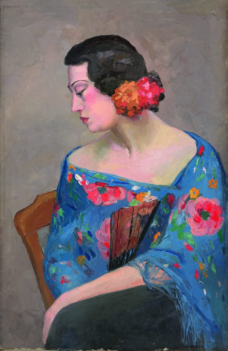 戴花持扇女人